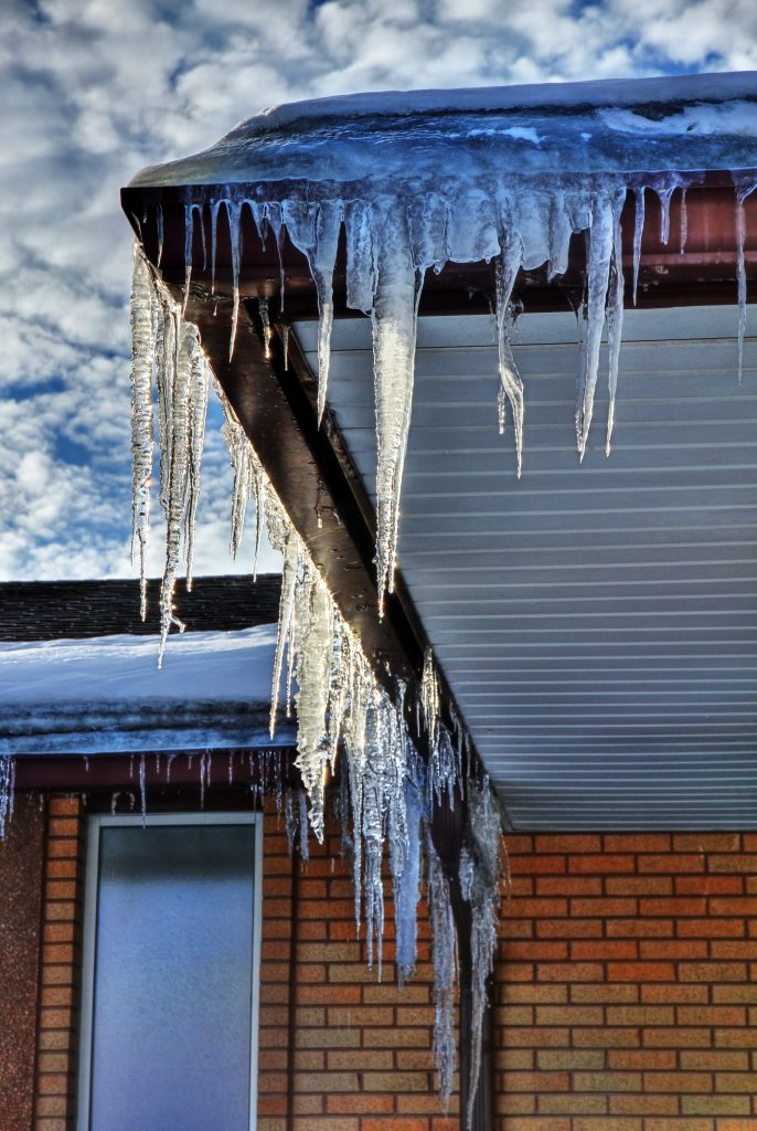 winter icicles clingin on house eaves