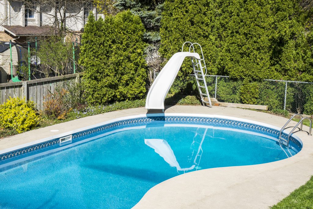 Swimming pool with a slide