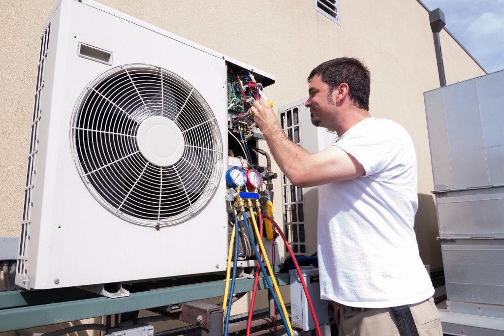 Technician Working on Condensing Unit