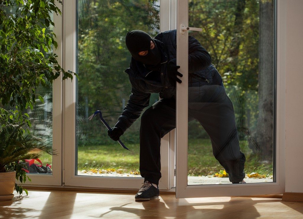 Burglar entering to house