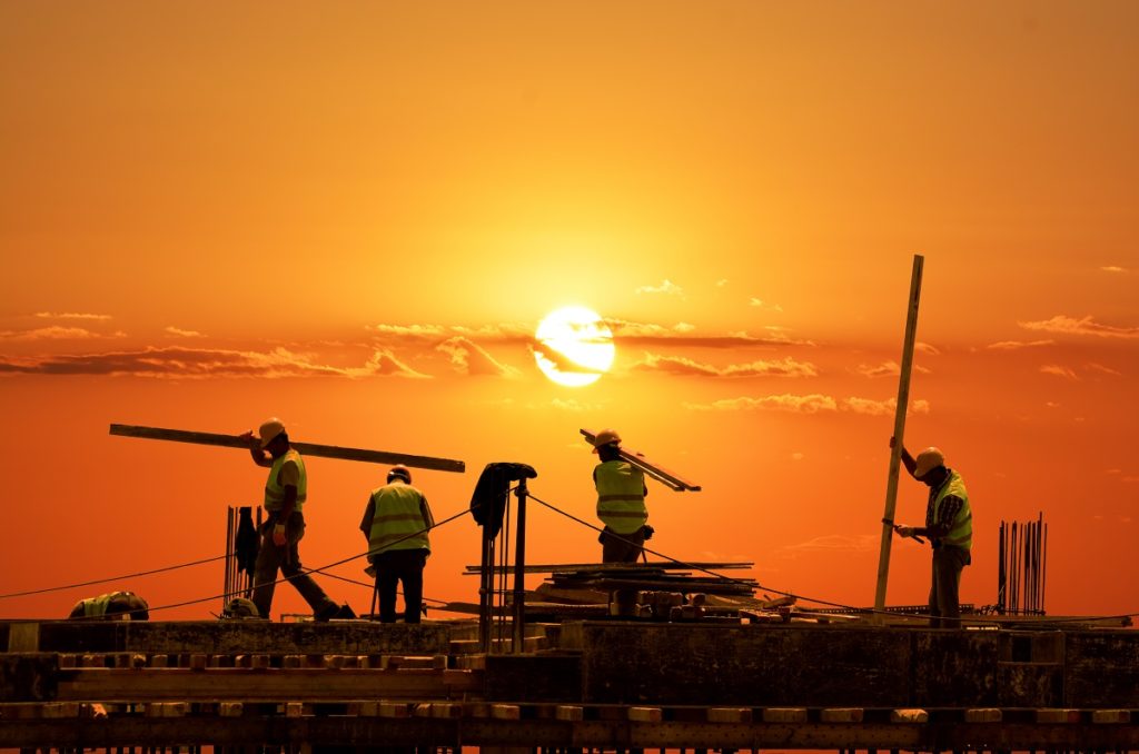 Employees working during sunset