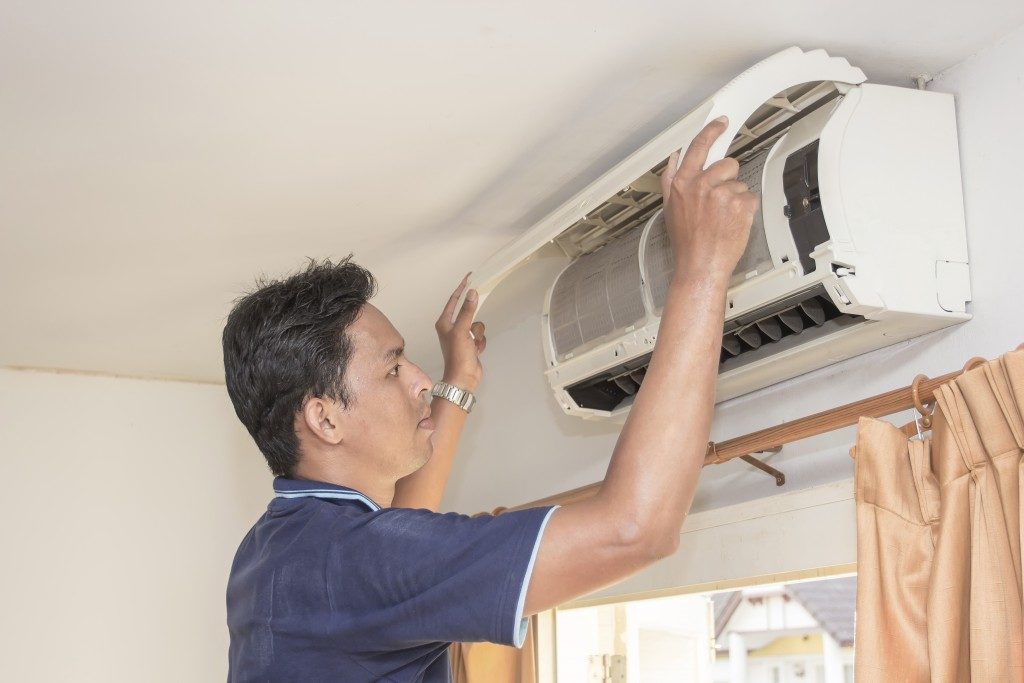 Man checking his AC unit