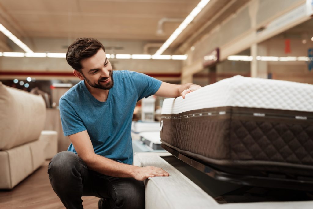 a man buying a mattress