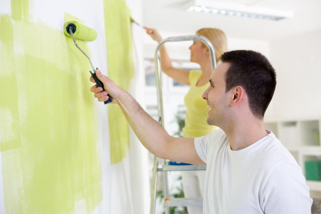 Couple painting walls