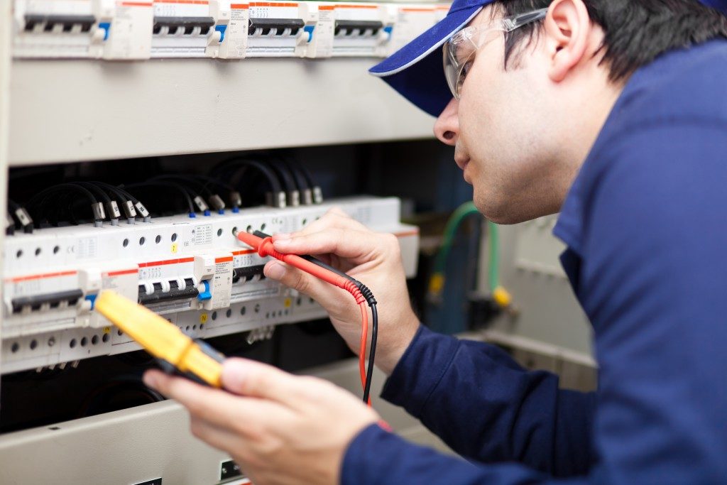 Electrician Checking Equipment