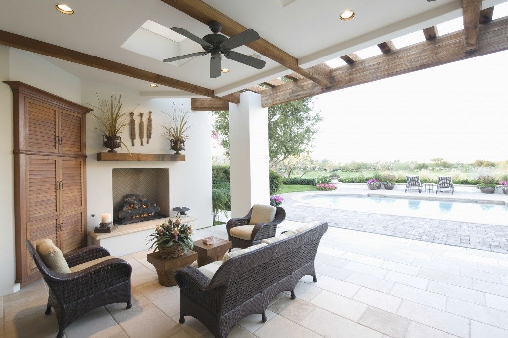 Swimming pool with seating area and fireplace in outdoors