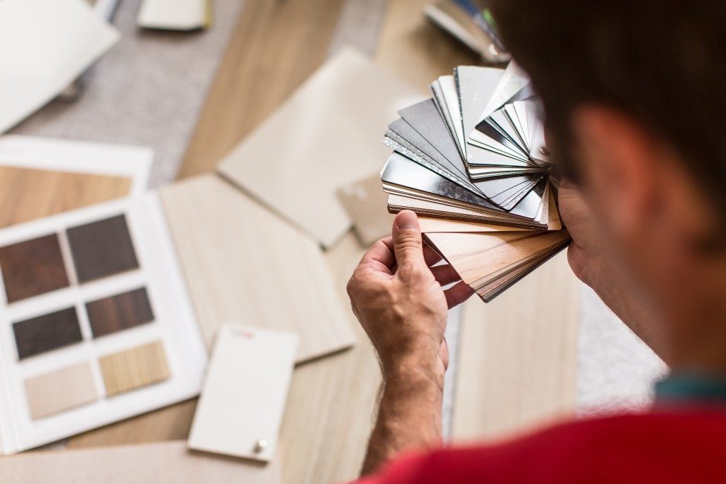 Man choosing flooring for his house