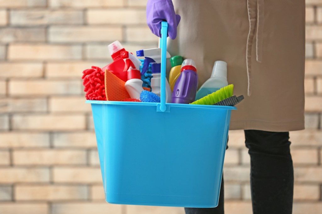 bucket full of cleaning tools