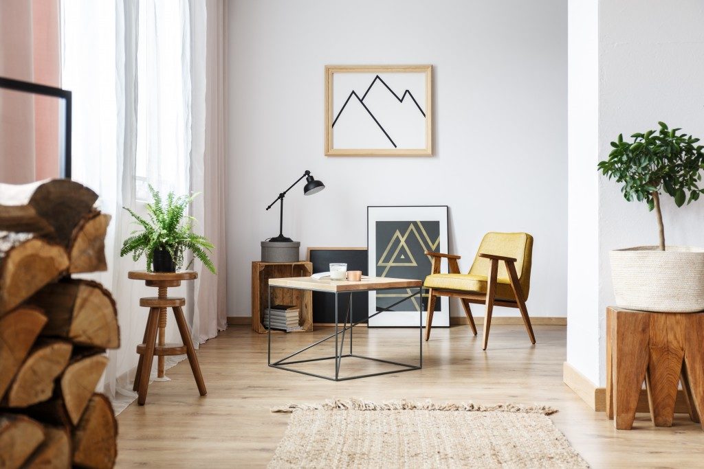 bright room with wood furniture and plants