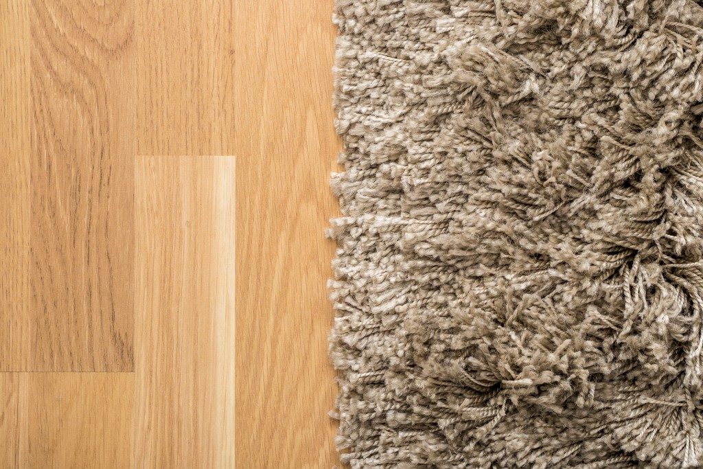 carpet on wooden flooring