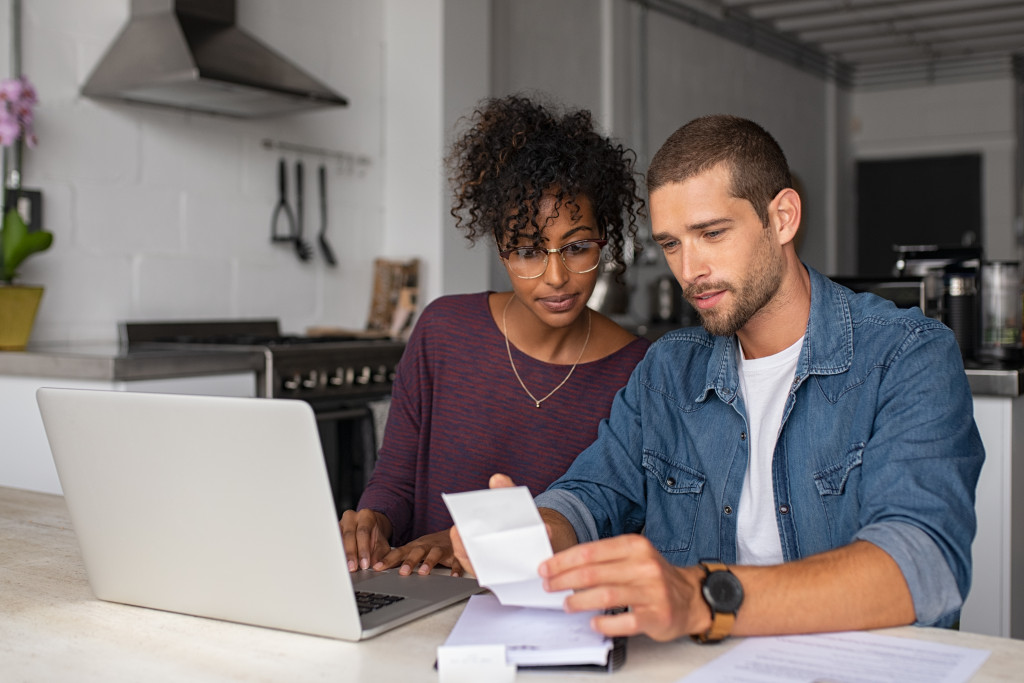 couple looking at the paper