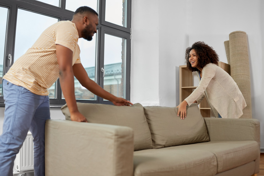 couple moving their big sofa